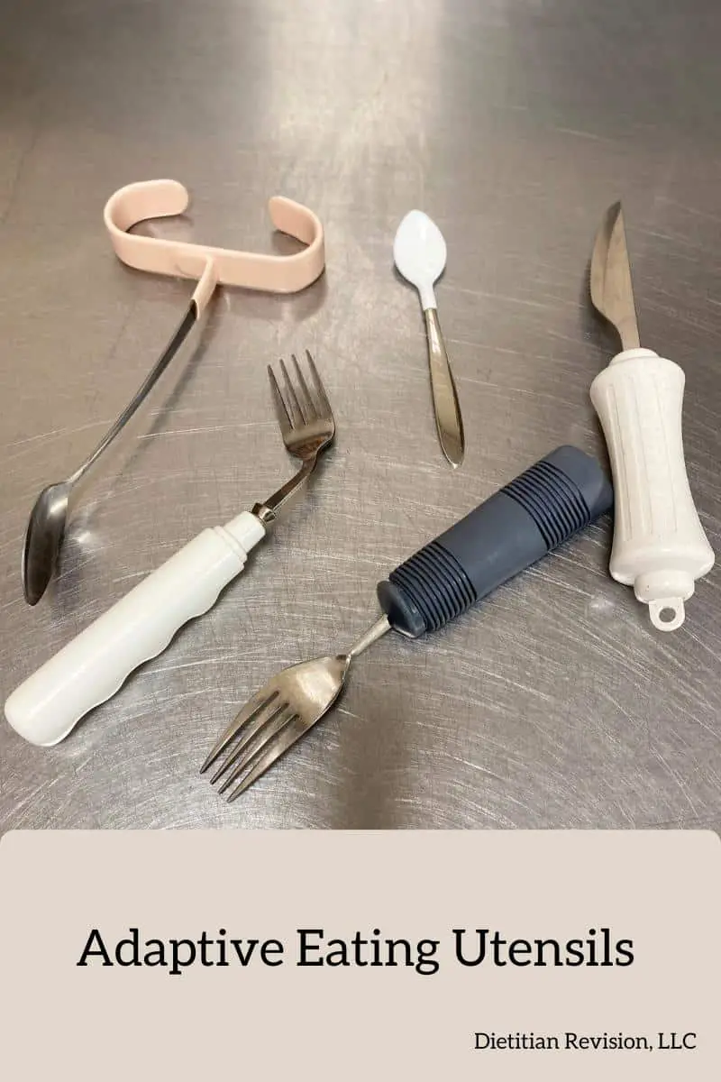 Grip handle spoon, curved built up fork, small coated spoon, built up fork, and built up knife sitting on stainless steel surface. 