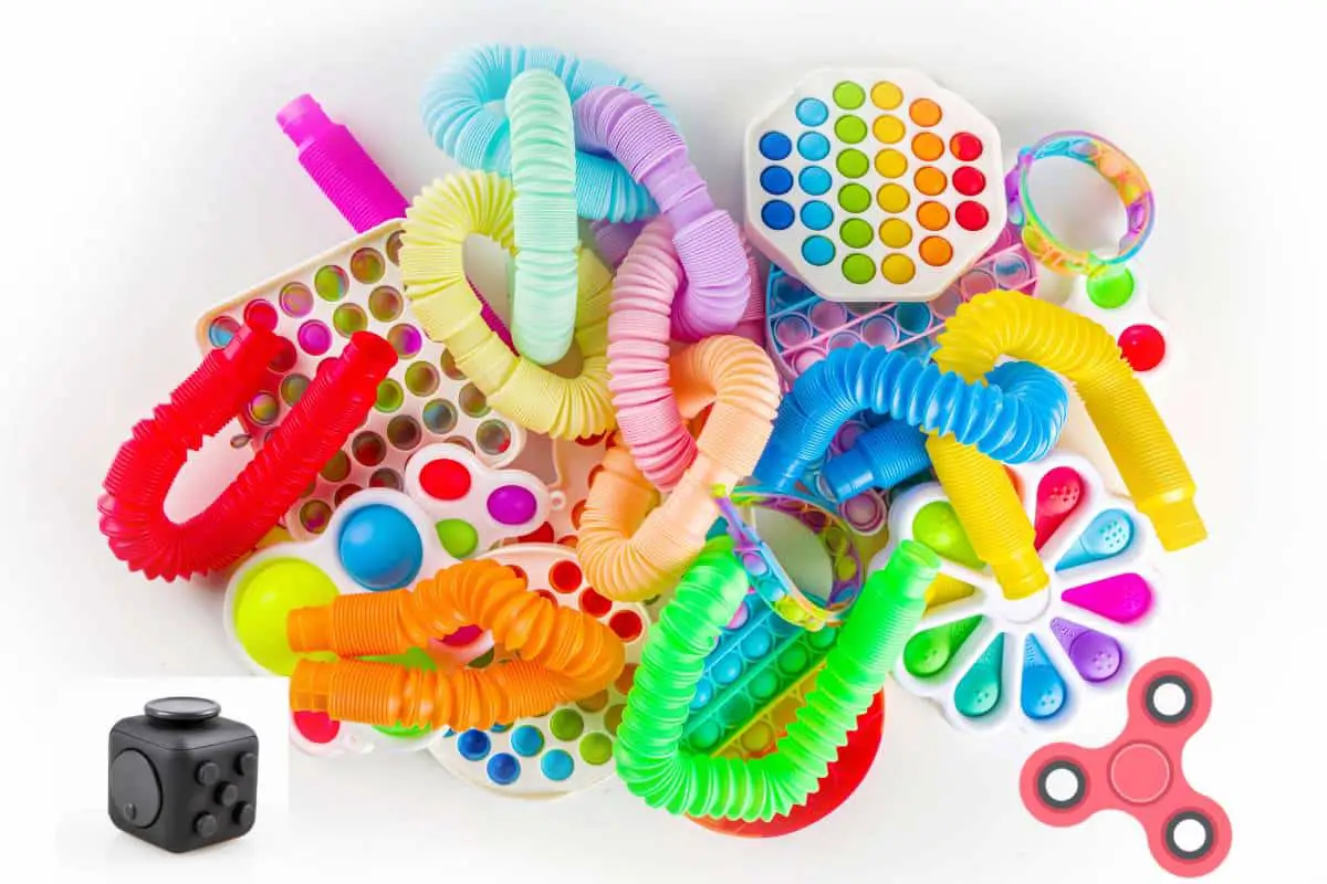 Various colorful fidget toys sitting on a white background. 