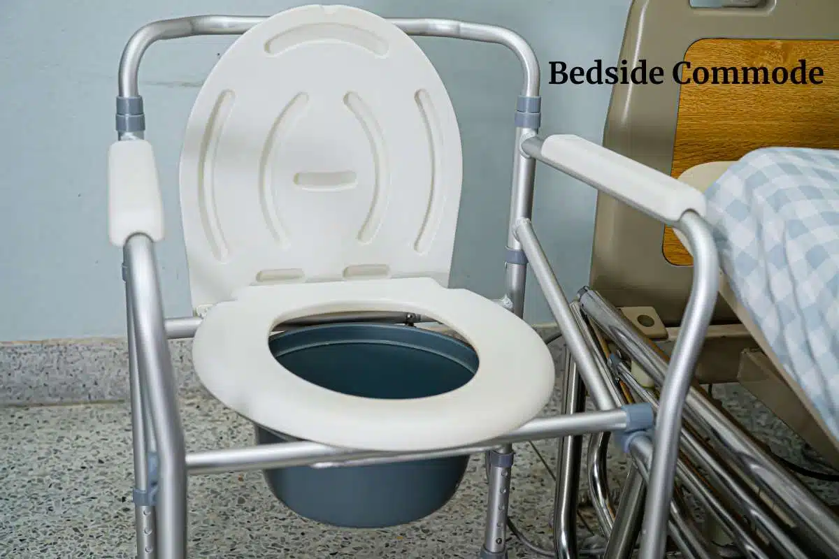 2 in 1 commode sitting next to a hospital bed. 