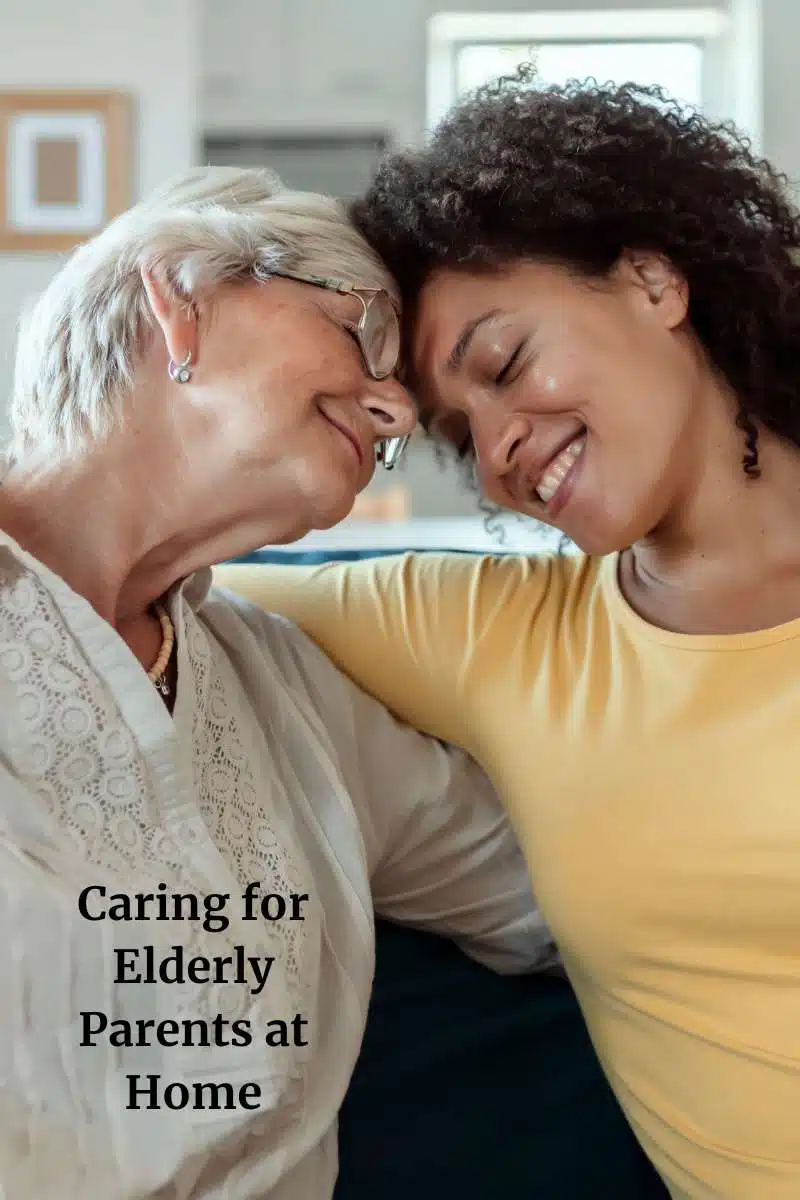 Elderly woman on the left with a younger woman on the right with their heads touching lovingly with the text caring for elderly parents at home.