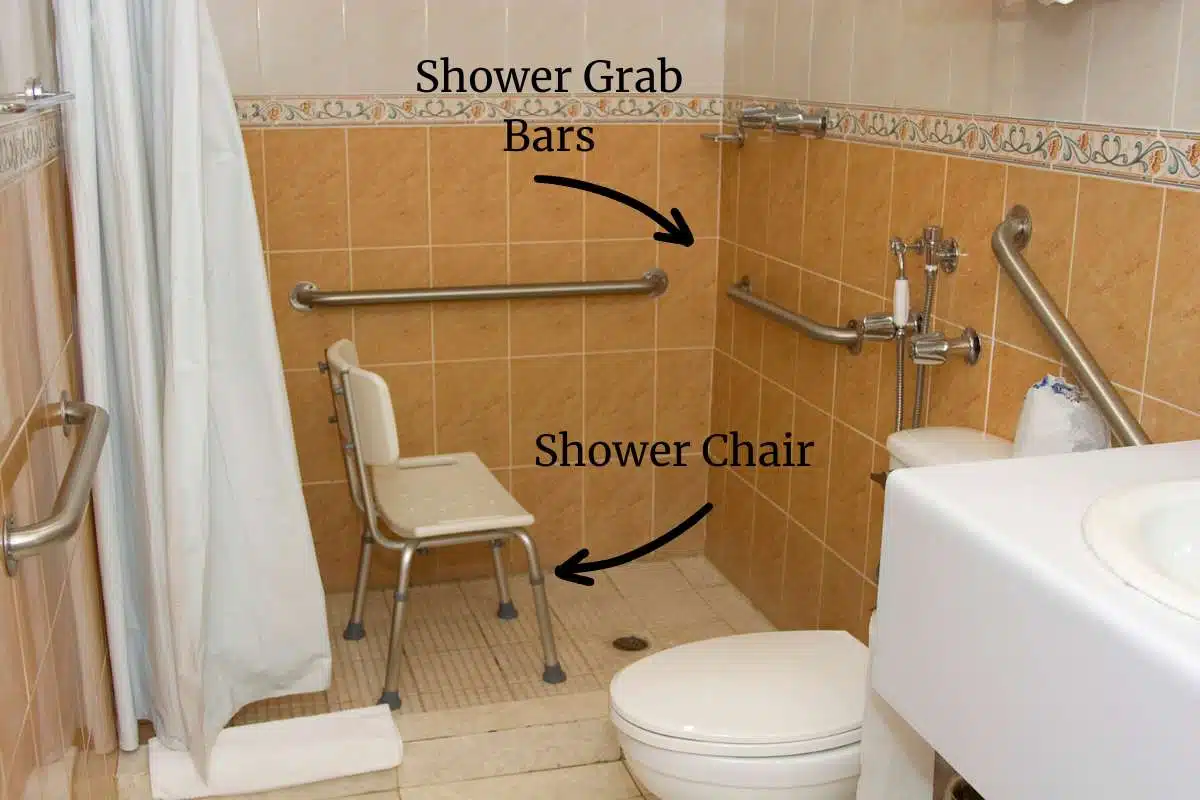 Accessible shower with shower chair and grab bars. 